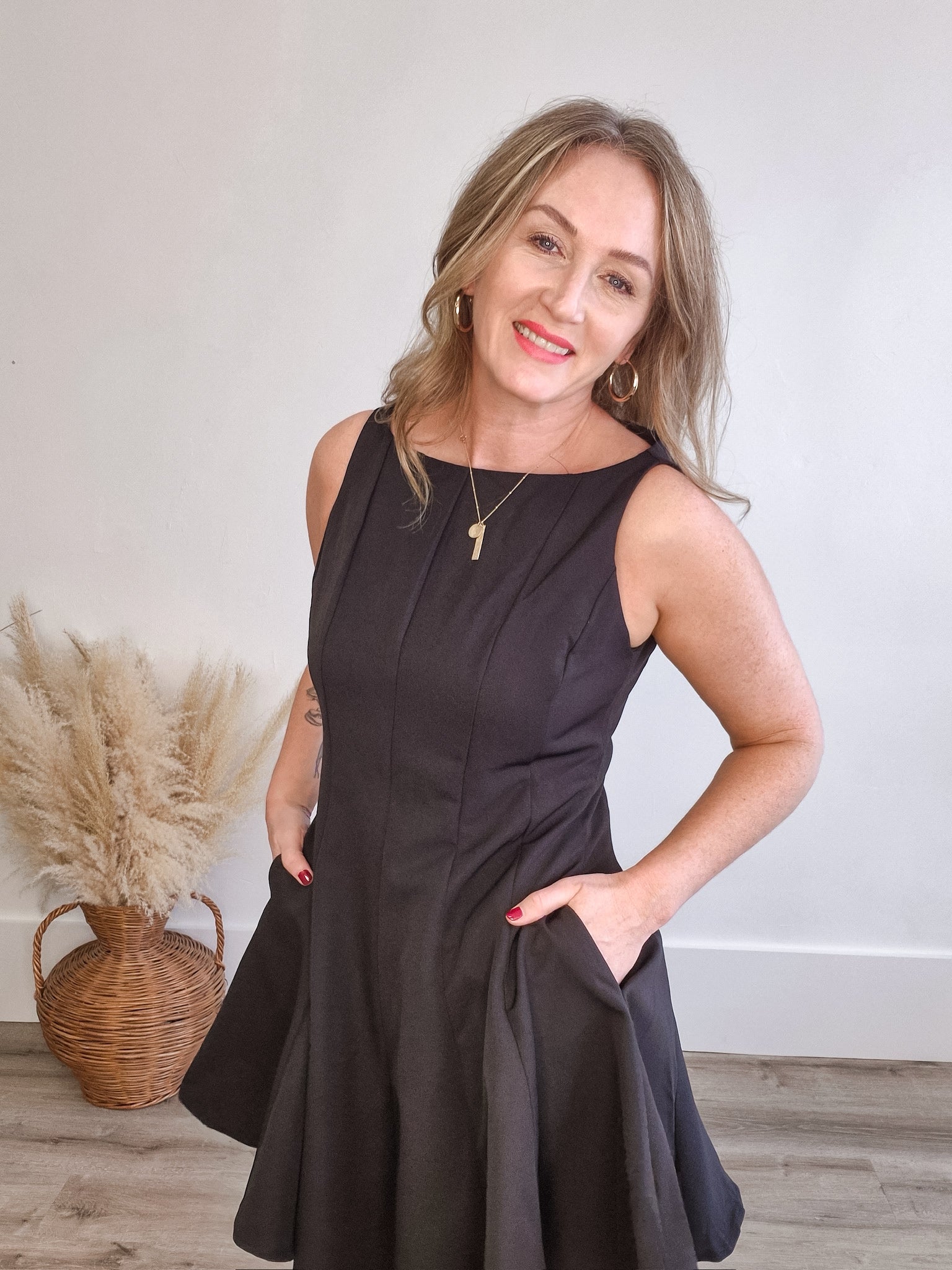 Sleeveless Flared Hemline Dress - Black-Special Occasion Dress- Hometown Style HTS, women's in store and online boutique located in Ingersoll, Ontario